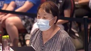 Xi Van Fleet, who survived Chairman Mao's Cultural Revolution, speaking before the Loudoun County school board Tuesday.