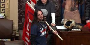 In this image from US Capitol Police video, Paul Allard Hodgkins, 38, of Tampa, Fla., front, stands in the well on the floor of the US Senate on January 6, 2021, at the Capitol in Washington.