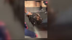 A Detroit woman tracked her stolen car for days - and then confronted the man driving it as he was getting his dreds done.