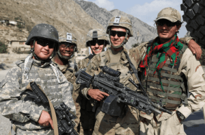 U.S. soldiers and their interpreters pose for a photo in Paktia province, Afghanistan, Aug. 20, 2012. (U.S. Army photo by Sgt. Kimberly Trumbull)