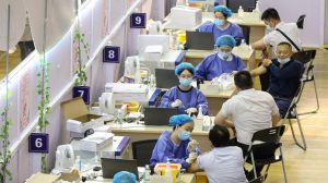 People receiving the China National Biotec Group (CNBG) COVID-19 coronavirus vaccine in Nantong, in China's eastern Jiangsu province, on July 5, 2021. (STR/AFP via Getty Images)
