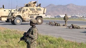 U.S soldiers stand guard along a perimeter at the international airport in Kabul, Afghanistan, Monday, Aug. 16, 2021. (AP Photo/Shekib Rahmani) (AP Photo/Shekib Rahmani)