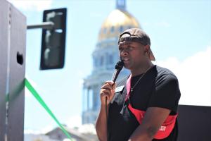 Denver Public Schools board member Tay Anderson addresses thousands of people participating in a June march for Black Lives Matter, organized by Denver Public Schools students, 2020.