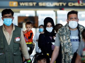 Afghan refugees arrive at Dulles International Airport in Northern Virginia while en route to military facilities in the U.S. (Jack Gruber-USA TODAY)