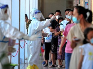 Residents queue to undergo nucleic acid tests for the Covid-19 coronavirus in Xianyou county, Putian city, in China’s eastern Fujian province on September 13, 2021. (Photo by -/CNS/AFP via Getty Images)