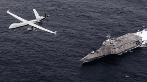 An MQ-9 SeaGuardian unmanned maritime surveillance aircraft system flies over Independence-variant littoral combat ship USS Coronado (LCS 4) during U.S. Pacific Fleet’s Unmanned Systems Integrated Battle Problem 21. (U.S. Navy photo by Chief Mass Communication Specialist Shannon Renfroe)