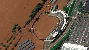 An after photo shows New Jersey baseball park completely wiped out by floodwater. Pic: AP/MAXAR