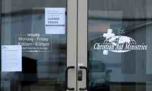 Signs on the door of the Christian Aid Ministries give updates on the Haiti kidnapping in Millersburg, Ohio. Photograph: Aaron Josefczyk/Reuters