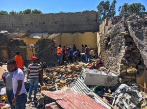AP Photo Residents sift through rubble from a destroyed building at the scene of an airstrike in Mekele, in the Tigray region of northern Ethiopia, October 28, 2021.