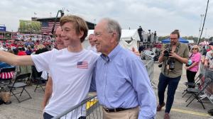 A young supporter takes a selfie with Sen. Chuck Grassley of Iowa, at former President Trump's rally in Des Moines, Iowa on Oct. 9, 2021. (Fox News)