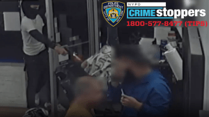 One of the suspects is seen opening fire at the victim. 