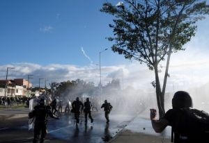 FILE PHOTO: Demonstrators and riot police clash during anti-government protests, as Colombia commemorates Independence Day, in Bogota, Colombia July 20, 2021. 
