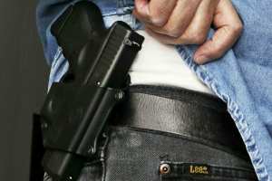 A holstered handgun. (Al Behrman/TNS)