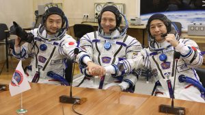 Alexander Misurkin, center, Yusaku Maezawa, right, and Yozo Hirano pose prior to the launch Wednesday, Dec. 8, 2021.  (Pavel Kassin, Roscosmos Space Agency via AP)
