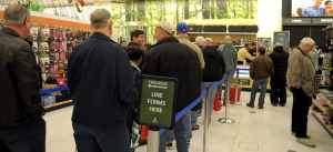 Team Scott members attend the grand opening of the Army and Air Force Exchange Services new gun counter on Scott Air Force, Il., Feb. 28, 2014. (U.S. Air Force photo/ Staff Sgt. Stephenie Wade)