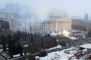 Smoke rises from the city hall building during a protest in Almaty, Kazakhstan, 5 January 2022. Source: AP