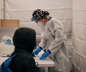 NEW YORK, NY - DECEMBER 27: A Medical worker administers a COVID-19 test at a new testing site inside the Times Square subway station on December 27, 2021 in New York City. After a week of record-breaking positive COVID test rates, New York City officials and agencies are working ramp up testing accessibility and turnaround times