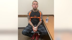 Tyler Henderson is pictured in handcuffs Sunday (Thomas County Sheriff's Office)