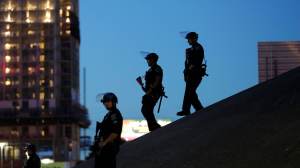 Austin police keep watch as demonstrators gather on June 4, 2020, in downtown Austin, Texas, as they protest the death of George Floyd. (AP Photo/Eric Gay, File)