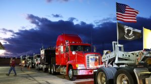 Truck drivers and supporters gather one day before a ‘People’s Convoy’ departs for Washington to protest COVID-19 mandates in Adelanto, Calif. on Feb. 22, 2022. (Mario Tama/Getty Images)