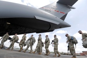 Tennessee National Guard troops board a plane in Smyrna, Tenn., on June 4, 2020. Three current and former members were falsely identified in a Russian media report as mercenaries killed in Ukraine, the Tennessee Guard said.Mark Humphrey / AP file