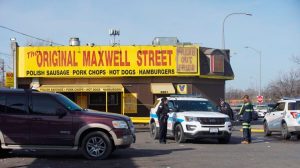 Chicago Police Department officials investigate an overnight shooting on the West Side in Chicago on March 4, 2022. (Pat Nabong/Chicago Sun-Times via AP)
