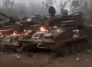 A group of abandoned Russian armored vehicles being burned in Ukraine. (Screenshot)