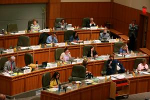 Democratic state Rep. Christine Chandler, of Los Alamos, with microphone, fields questions from legislators in the New Mexico House of Representatives in Santa Fe, N.M., on Tuesday, April 5, 2022, about a bill to provide tax rebates and payments to offset the rising consumer prices. 

AP Photo/Morgan Lee
