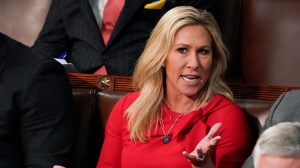 Rep. Marjorie Taylor Greene talks during President Joe Biden's State of the Union address at the Capitol on March 1, 2022. (AP Photo/J. Scott Applewhite, Pool, File)