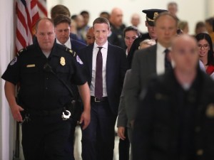 Mark Zuckerberg surrounded by guards ( Chip Somodevilla /Getty)