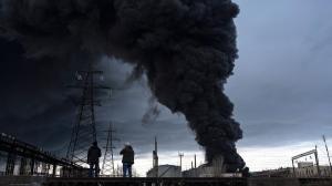 People watch as smoke rises in the air after shelling in Odesa, Ukraine, Sunday, April 3, 2022.  (AP)