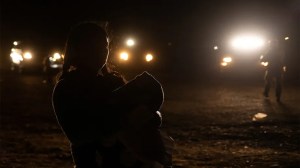 Image 2 of 3
Diana, a migrant woman from Guatemala, is backlighted by Border Patrol vehicles as she holds her 7-month-old son Jarrell after crossing the Rio Grande in Roma, Texas, April 7, 2022. (Reuters/Adrees Latif)