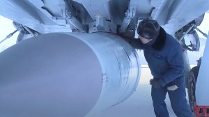 FILE - An airman checks a Russian Air Force MiG-31 fighter jet prior a flight with Kinzhal hypersonic missile during a drill in an unknown location in Russia, in this still image taken from video released February 19, 2022.  (Russian Defence Ministry/Handout via REUTERS)