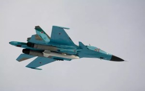 An Su-34 fighter-bomber with Russian President Dmitry Medvedev aboard flies over the Kubinka airfield near Moscow on March 28, 2009.