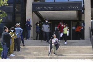 Parents wait in line to pick up their children at Walt Disney Magnet School at 4100 N Marine Dr in Buena Park, Tuesday May 17, 2022.Anthony Vazquez/Sun-Times