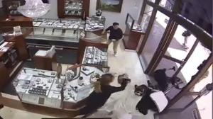 Surveillance video from Princess Bride Diamonds shows workers fight off smash and grab robbers at Bella Terra mall in Huntington Beach, California.  (Princess Bride Diamonds)