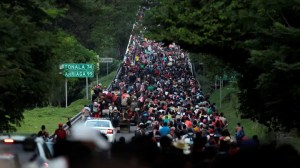 Migrants walk in a caravan heading to Mexico City, in Pijijiapan, Mexico in 2021. The new caravan is expected to be the largest ever.