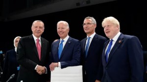 From left, Turkish President Recep Tayyip Erdogan, U.S. President Joe Biden, NATO Secretary General Jens Stoltenberg and British Prime Minister Boris Johnson pose for photographers during a round table meeting at a NATO summit in Madrid, Spain on Wednesday, June 29, 2022.  (AP Photo/Susan Walsh, Pool)
