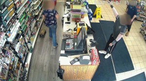 A still image taken from surveillance video shows a boy rob a gas station in Hartford at gunpoint on June 1, 2022.
