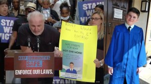 A photo combination of John Toomey speaking out at a press conference about his son's murder. On the right is a photo of 15-year-old Seen Toomey. (Screenshot of press conference/ family handout)