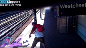 Terrifying video shows the moments a man physically lifts a woman from a New York City subway platform and pushes her into the train tracks. (NYPD)