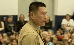 U.S. Marine Capt. Grady Kurpasi, commanding officer of Headquarters Company, 2nd Marine Regiment, speaks at an elementary school assembly in Swansboro, N.C., Jan. 25, 2019. (U.S. Marine Corps photo by Lance Cpl. Aaron Douds)