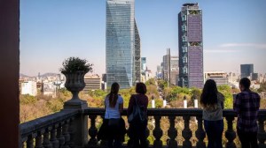 Skyline in daytime of Mexico City People in foreground, at Chapultepec Castle, and Paseo de la Reforma in distance, Mexico City, Mexico.  (Photo by: Jumping Rocks/Education Images/Universal Images Group via Getty Images)