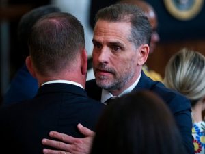 UNITED STATES - JULY 7: Hunter Biden, right, the son of President Joe Biden, greets Labor Secretary Marty Walsh during a ceremony to present the Presidential Medal of Freedom, the nation's highest civilian honor, to 17 recipients at the White House on Thursday, July 7, 2022. (Tom Williams/CQ Roll Call)