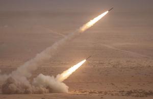 A U.S. M142 High Mobility Artillery Rocket System (HIMARS) fires salvoes during A military exercise in the Tan-Tan region in southwestern Morocco on June 30, 2022. (FADEL SENNA/AFP via Getty Images/TNS)
