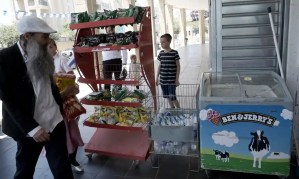 Israelis enter a supermarket selling Ben & Jerry’s in the illegal Jewish settlement Har Homa, south of Jerusalem, last month. Photograph: Debbie Hill/UP/Rex/Shutterstock