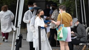 People wait to receive the monkeypox vaccine at a mass vaccination site in Manhattan on July 26, 2022, in New York City.  (Liao Pan/China News Service via Getty Images)
