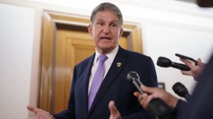 Sen. Joe Manchin, D-W.Va., is met by reporters outside the hearing room where he chairs the Senate Committee on Energy and Natural Resources at the Capitol in Washington, on July 21, 2022. (The Associated Press)