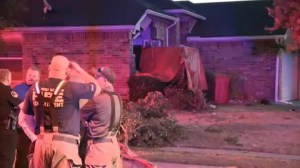 A suspected drunk driver crashed into a home in White Settlement, Texas, killing a teen girl and seriously injuring her father, police said. (FOX4 Dallas-Fort Worth KDFW)