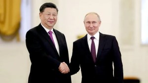 Russian President Vladimir Putin shakes hands with his Chinese counterpart Xi Jinping. (Reuters/Evgenia Novozhenina/Pool)
